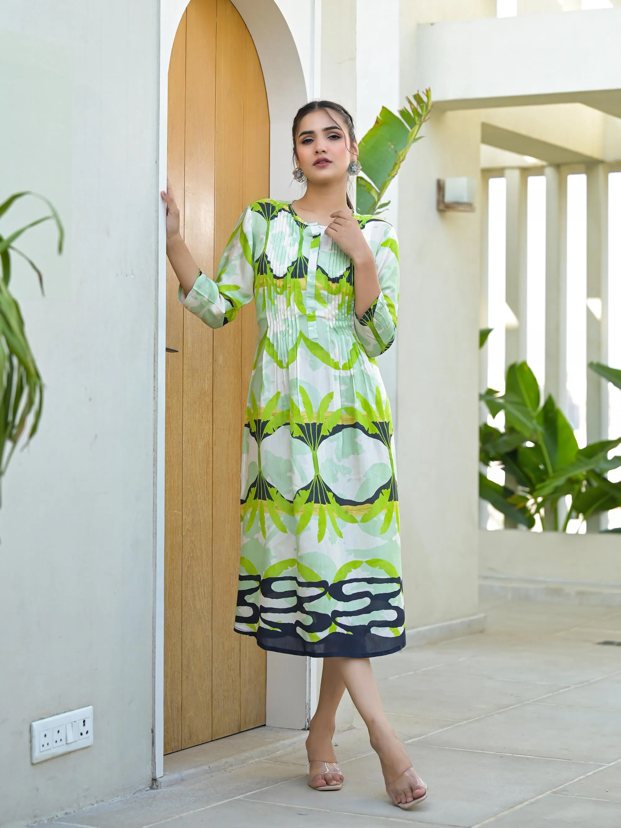 Green muslin boat neck knee length dress with ethnic print